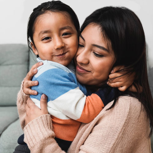 A mother and daughter embracing in a hug
